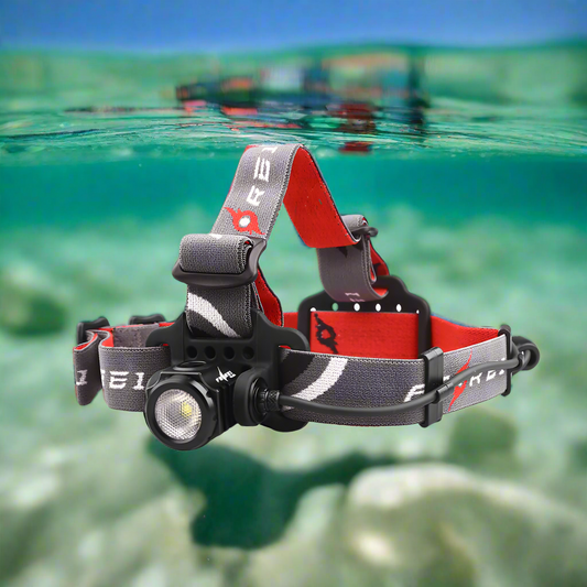 FEREI HL65 – 1500 Lumen Waterproof Headtorch (50m Rated), with a Red and Gray branded head strap, floating in clear water with a blue sky above.